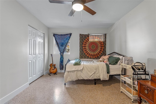 bedroom with ceiling fan and a closet