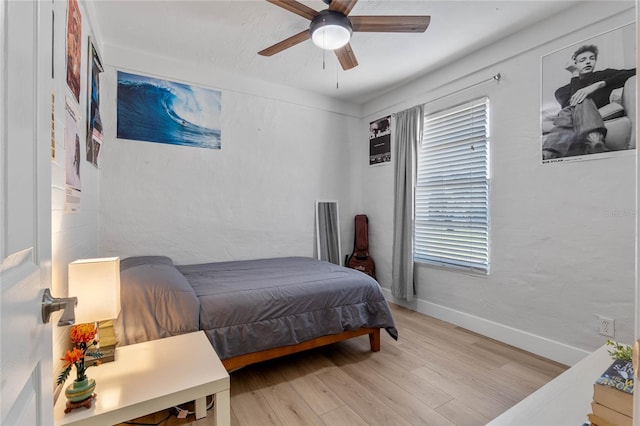 bedroom featuring light hardwood / wood-style floors and ceiling fan