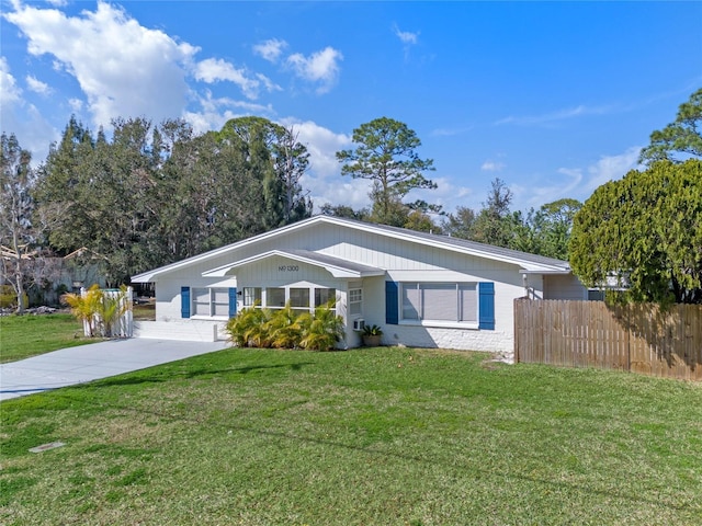 ranch-style house with a front lawn