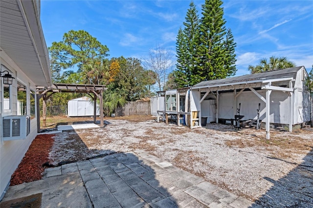 view of patio featuring a shed