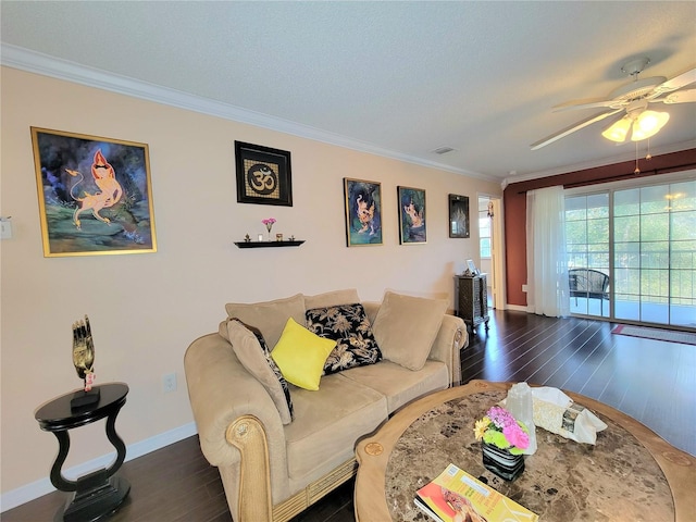 living room featuring crown molding, dark wood-type flooring, and ceiling fan