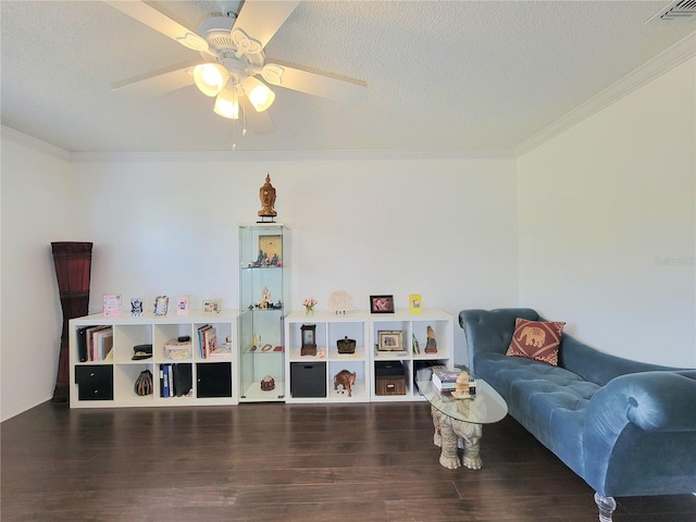 interior space featuring crown molding, dark wood-type flooring, ceiling fan, and a textured ceiling