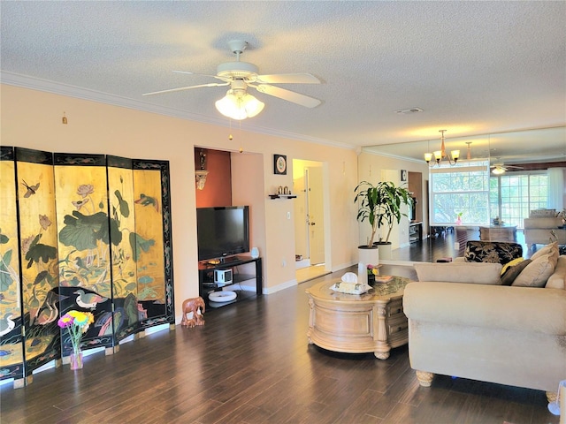 living room with dark wood-type flooring, crown molding, ceiling fan with notable chandelier, and a textured ceiling