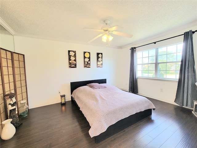 bedroom with ornamental molding, dark wood-type flooring, and a textured ceiling