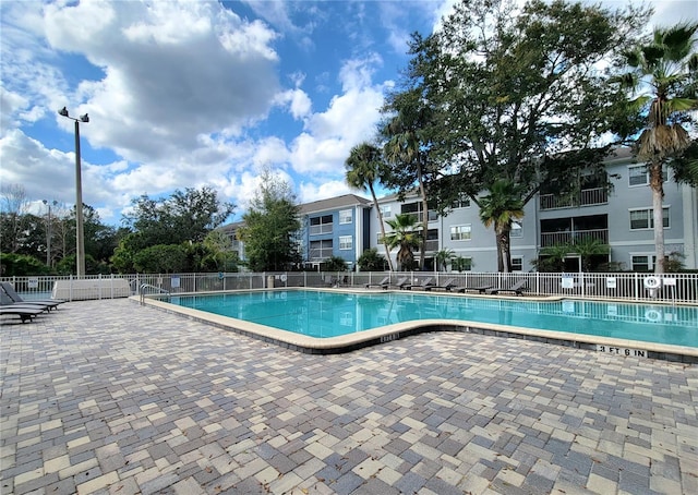 view of swimming pool with a patio