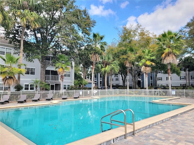 view of swimming pool with a patio