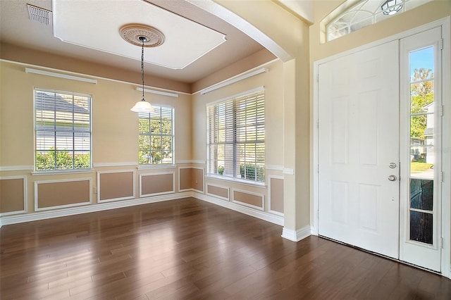 foyer with dark hardwood / wood-style flooring