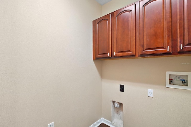 washroom with cabinets, hookup for a washing machine, and electric dryer hookup