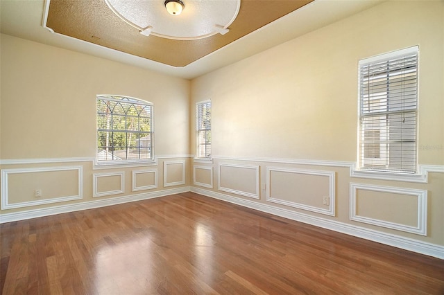 spare room with hardwood / wood-style flooring