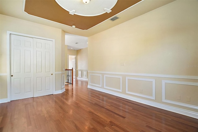 spare room with wood-type flooring