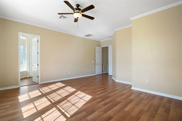 spare room featuring crown molding, ceiling fan, and wood-type flooring