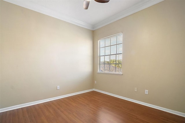 empty room featuring wood-type flooring, ceiling fan, and crown molding