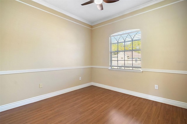 spare room with ceiling fan, ornamental molding, and wood-type flooring