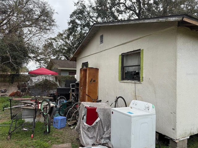 2219 W Pine St, Orlando, FL 32805 - view of property exterior featuring washer / dryer