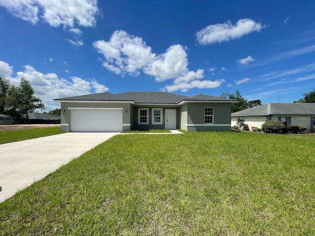 single story home with driveway, a front lawn, an attached garage, and stucco siding