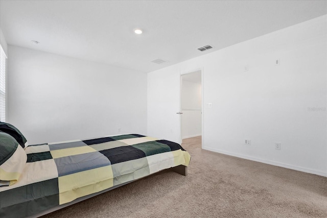 carpeted bedroom featuring baseboards, visible vents, and recessed lighting