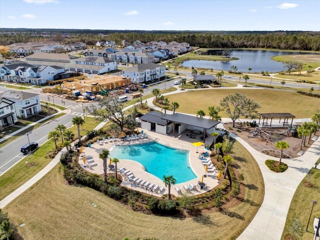 bird's eye view featuring a residential view and a water view