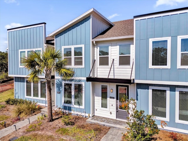 view of front of home featuring roof with shingles and board and batten siding