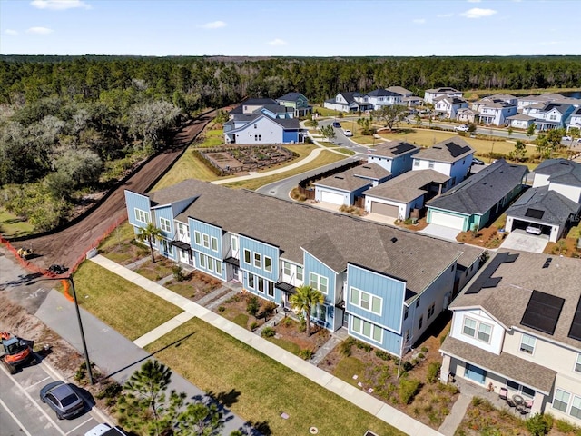 aerial view featuring a residential view and a view of trees