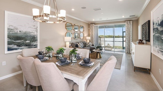 dining space featuring light tile patterned floors, ornamental molding, a chandelier, and a water view