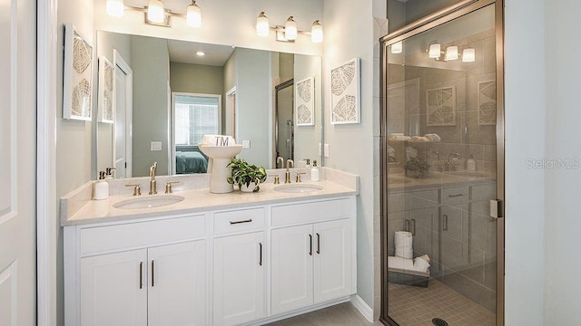 bathroom featuring vanity and a shower with shower door