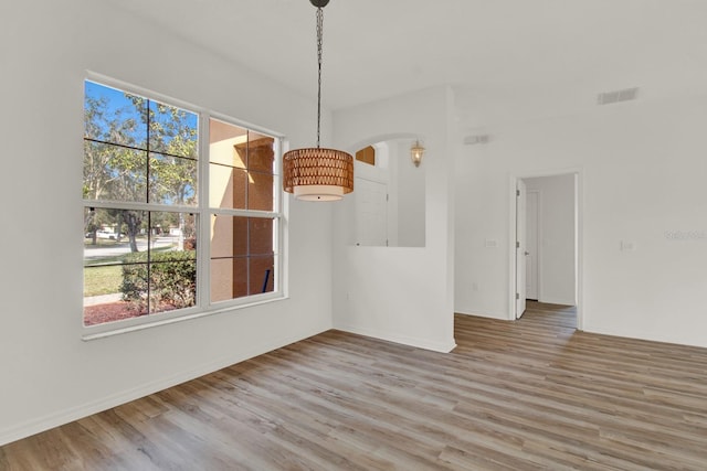 unfurnished dining area with hardwood / wood-style flooring