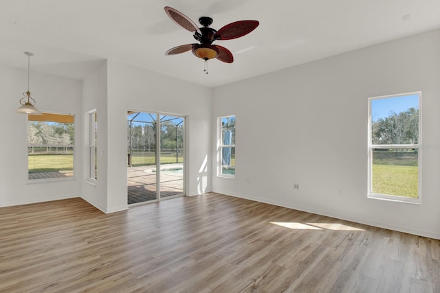 unfurnished room featuring ceiling fan and light wood-type flooring