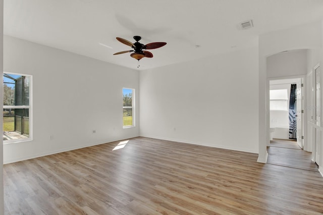 spare room with ceiling fan and light hardwood / wood-style flooring