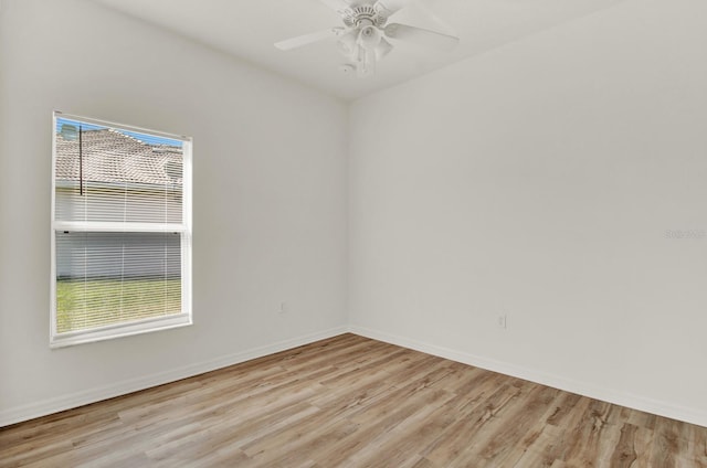 empty room featuring ceiling fan and light wood-type flooring