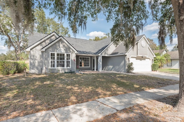 single story home featuring a garage and a front yard