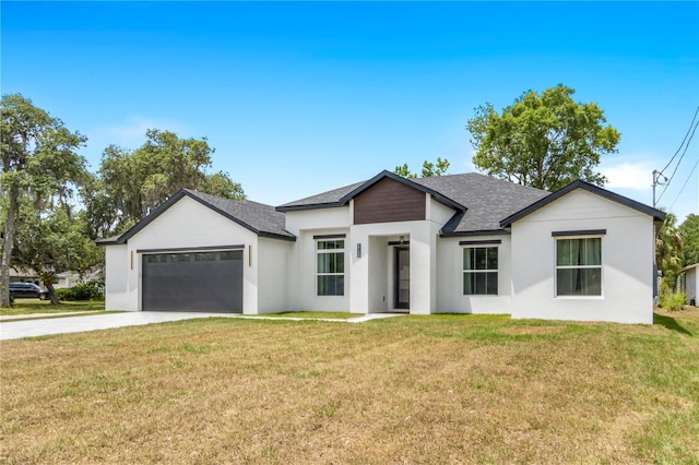 view of front of house featuring a garage and a front yard