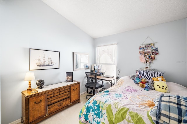 bedroom with lofted ceiling, light colored carpet, and a textured ceiling