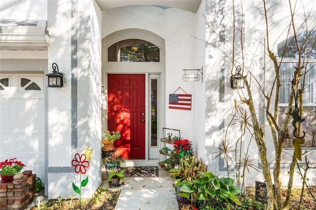 property entrance featuring stucco siding