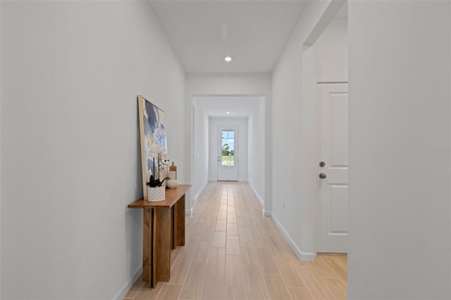 hall with light hardwood / wood-style flooring