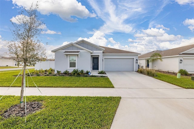 view of front of house with a garage and a front yard