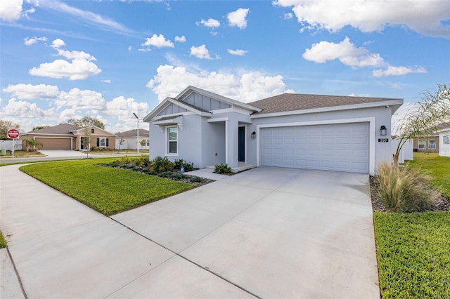 view of front of house featuring a garage and a front lawn