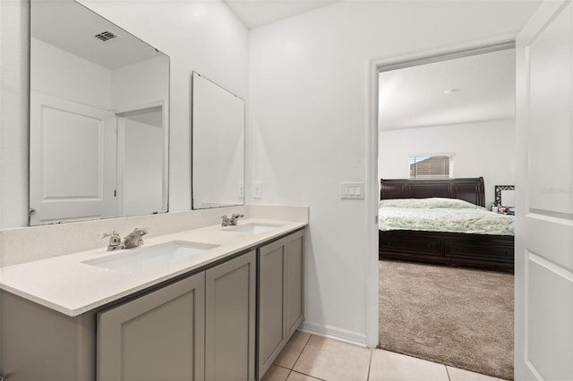 bathroom with vanity and tile patterned flooring