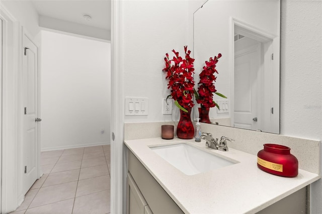 bathroom featuring tile patterned flooring and vanity