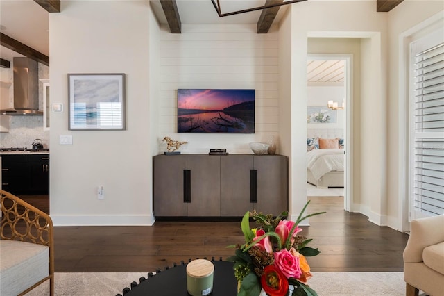 living room featuring beam ceiling and dark hardwood / wood-style flooring