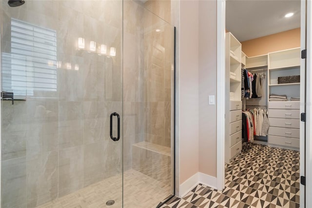 bathroom with a shower with shower door