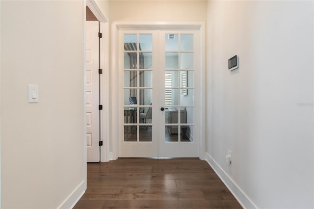 doorway featuring french doors and dark hardwood / wood-style floors