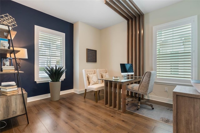 office space with dark wood-type flooring