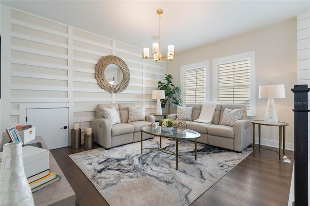 living room featuring dark wood-type flooring and a chandelier