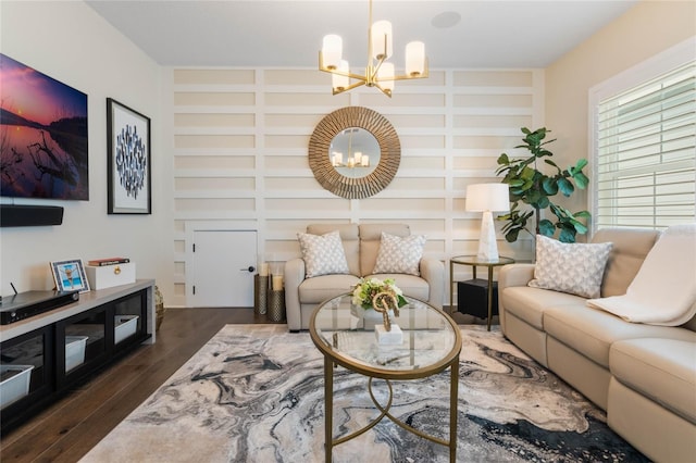 living room featuring a notable chandelier, built in features, and dark hardwood / wood-style flooring