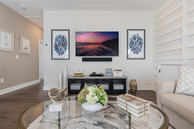 living room with dark hardwood / wood-style floors and built in features