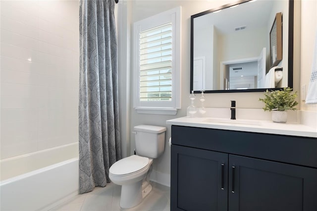 full bathroom featuring vanity, tile patterned floors, toilet, and shower / tub combo with curtain