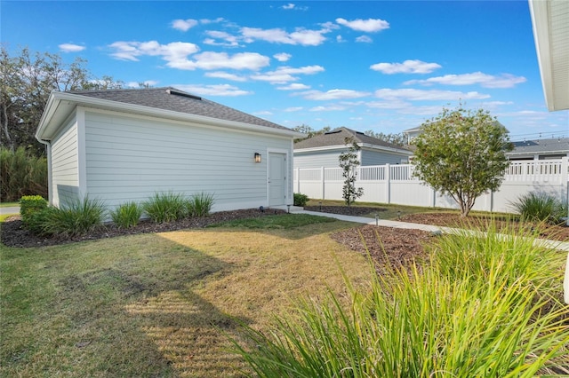 view of home's exterior with a lawn