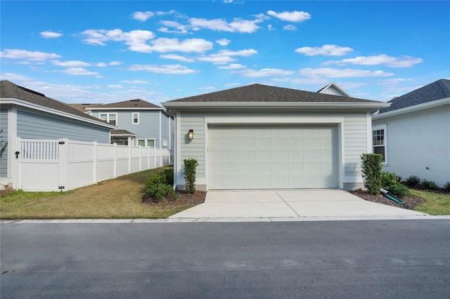 view of front of home with a garage and a front lawn