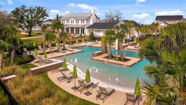 view of swimming pool featuring a patio area