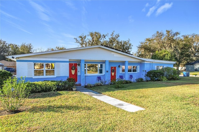 ranch-style house with a front lawn